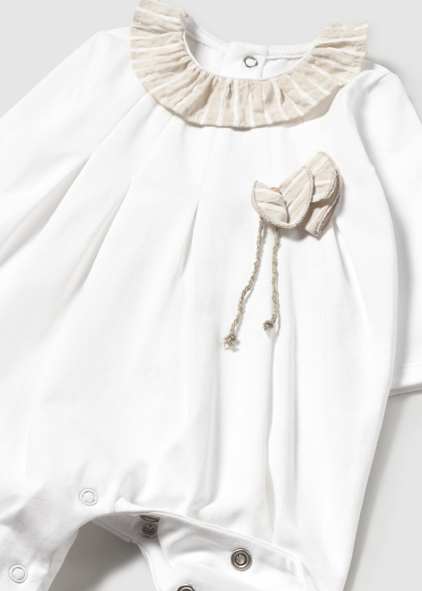 Tutina con dettagli a righe