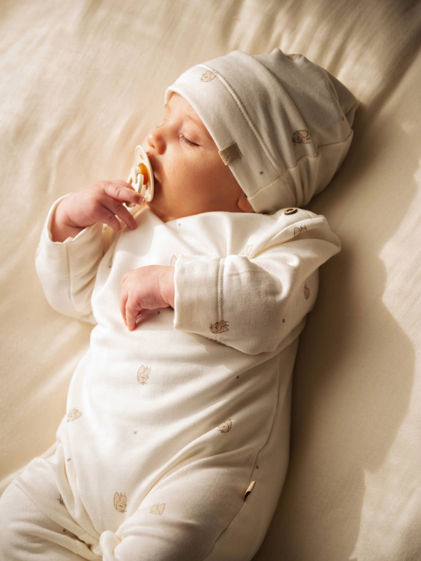 Tutina con apertura spalla