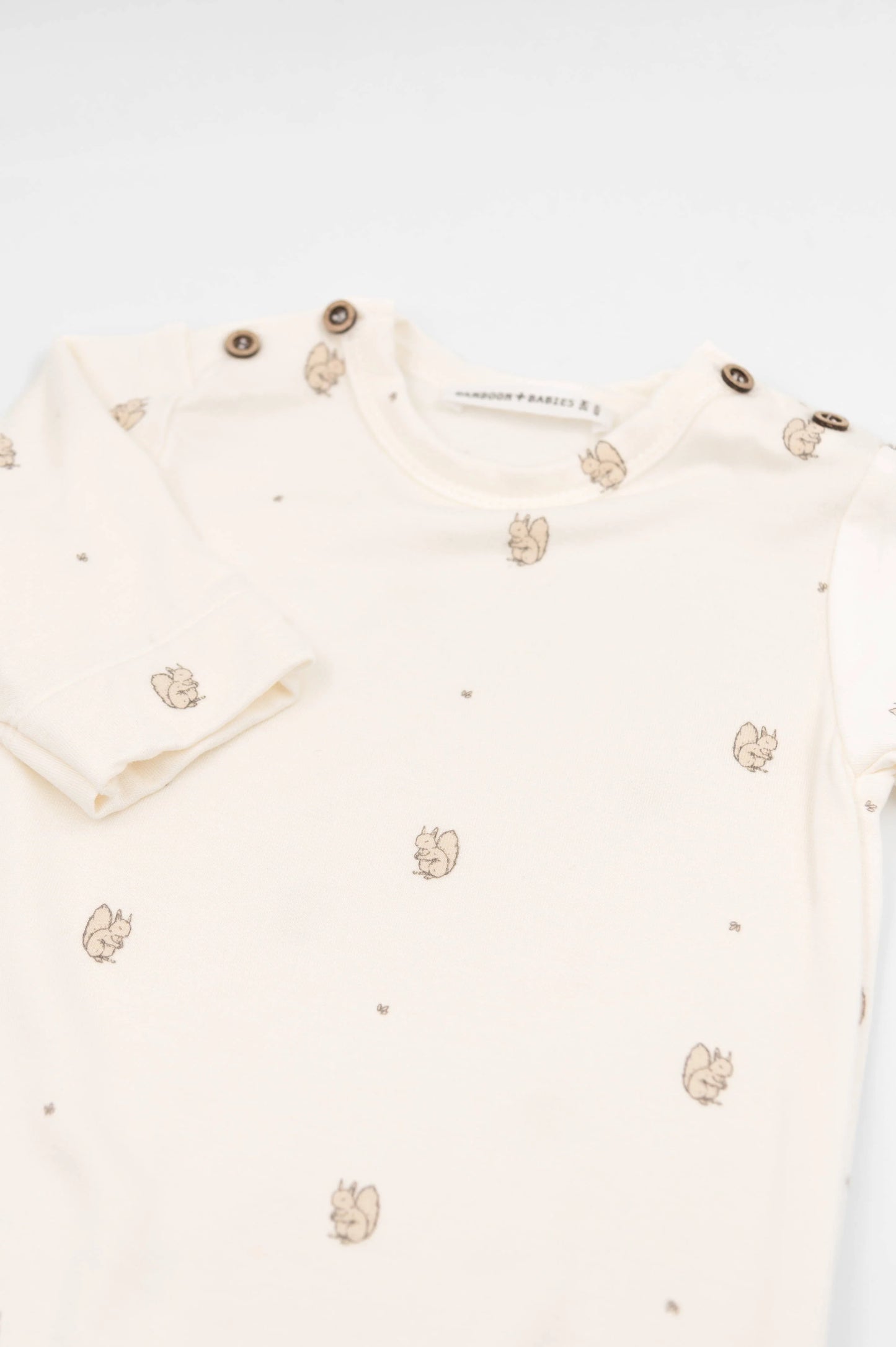 Tutina con apertura spalla